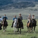 Bitterroot Ranch - Horseback riders on the plains.