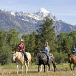 R Lazy S Ranch - horseback riders on the plains.