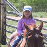 Vee Bar - Young girl on horseback.