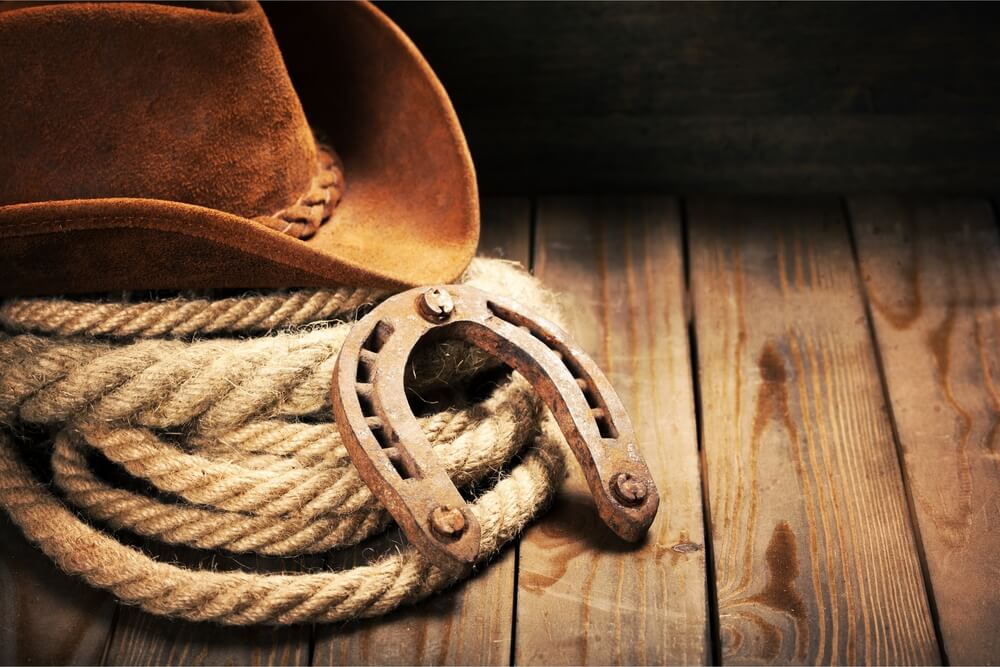 Photo of cowboy hat and rope: why is it called a dude ranch