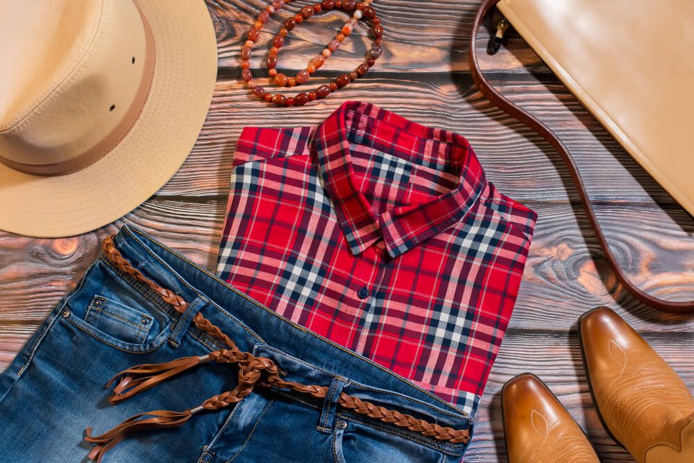 Photo of western clothes, boots, and hats: dude ranch packing list
