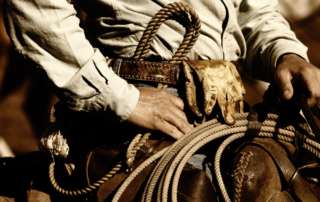 Close-up of a cowboy on a horse during a wild west vacation with WDRA