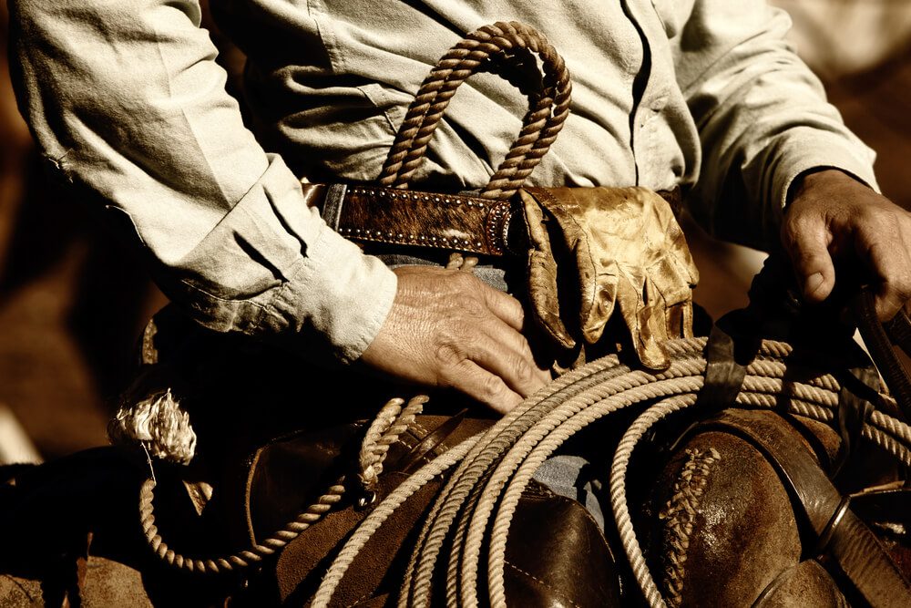 Close-up of a cowboy on a horse during a wild west vacation with WDRA