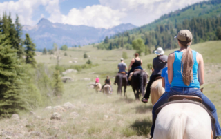 group horseback riding at Wyoming dude ranches: group vacation ideas