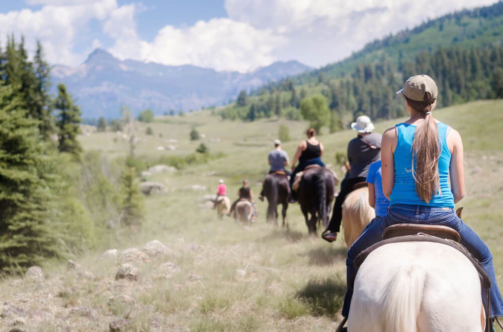 group horseback riding at Wyoming dude ranches: group vacation ideas