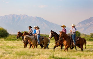 People riding horses at Wyoming guest ranches