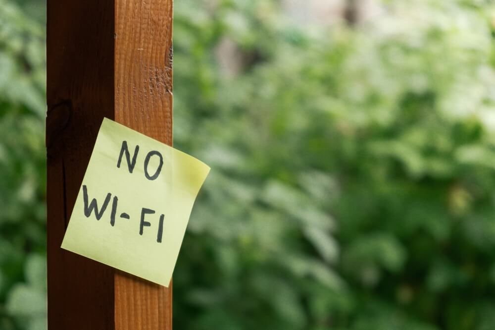 Sign stating "no WiFi" during a digital detox retreat at Wyoming dude ranches